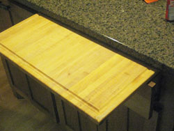 A long natural wood cutting board