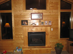A light wooden fireplace with matching mantle